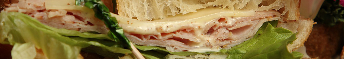 Eating Sandwich at Deli George restaurant in Boise, ID.